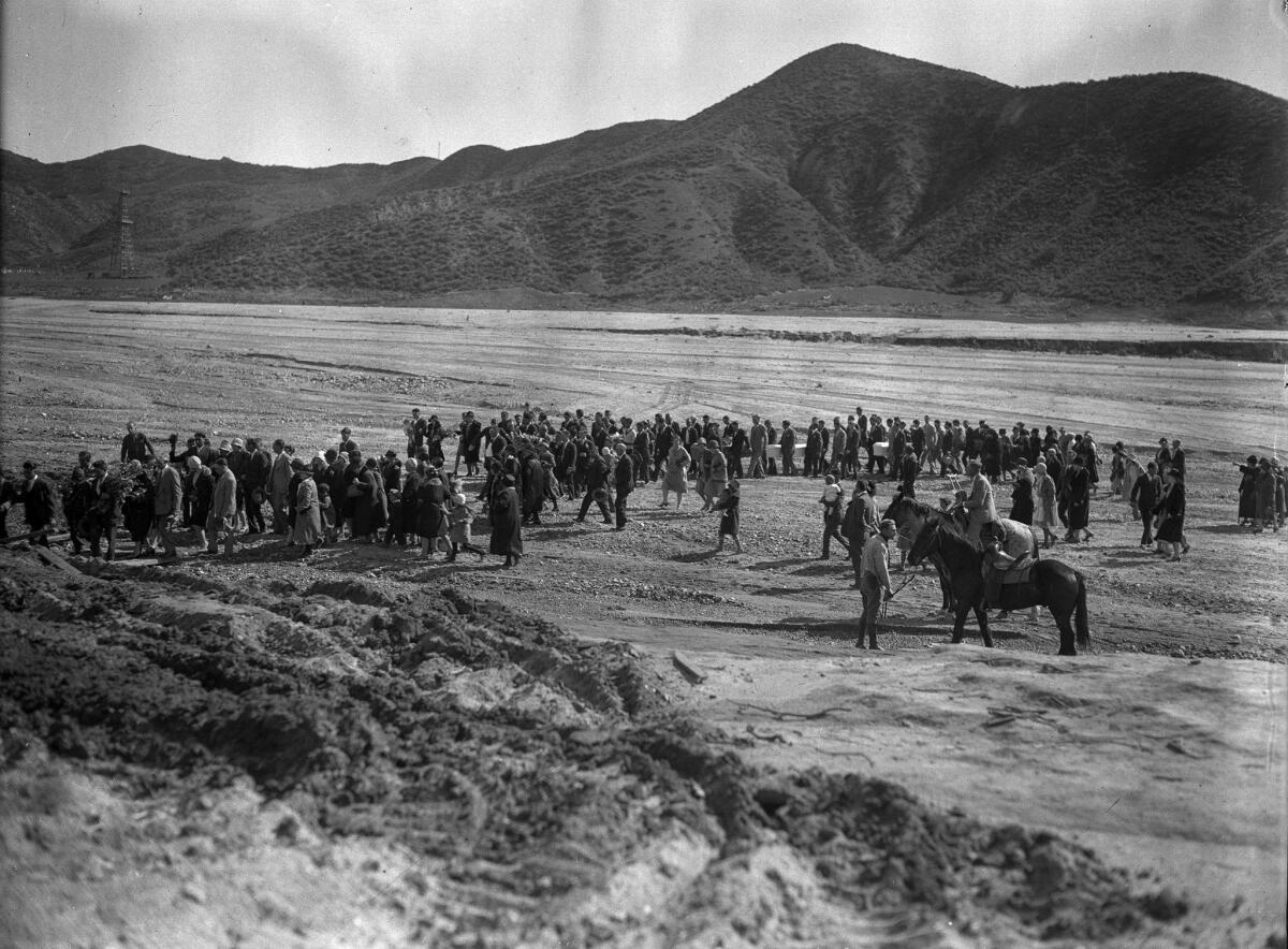 March 1928: Funeral procession proceeds across floodplain following the St. Francis Dam disaster.