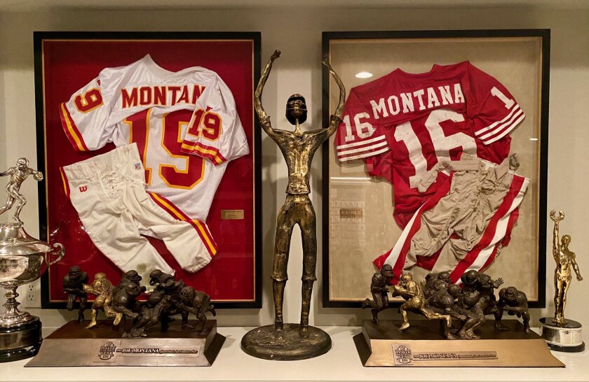 Joe Montana keeps framed jerseys from his playing days with the Kansas City Chiefs, left, and San Francisco 49ers.
