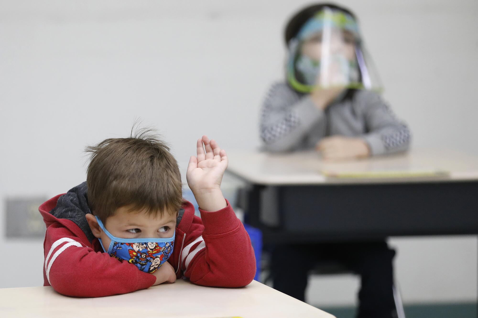 Nathan Marzouk raises his hand during class with kindergarten teacher Ursula Dysthe at Lupin Hill Elementary School.