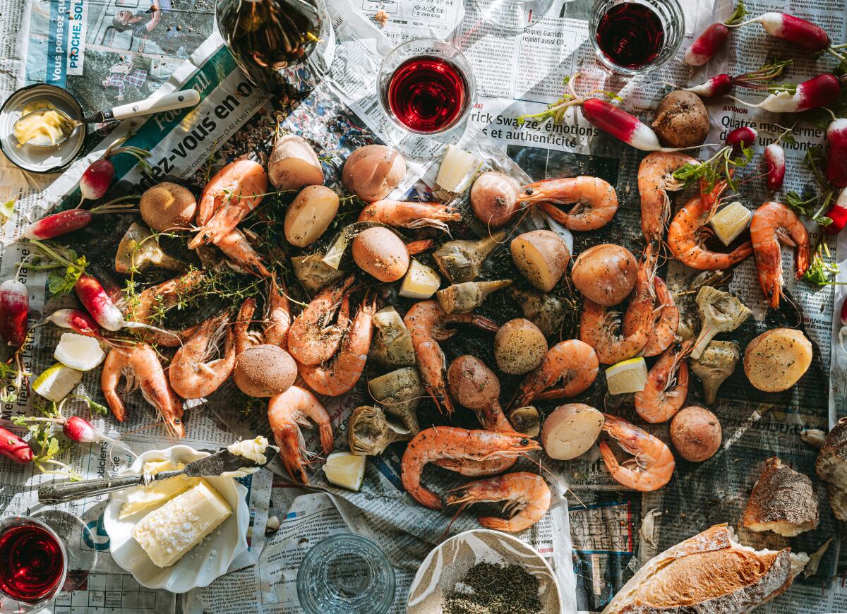 A French shrimp boil atop a newspaper-lined table