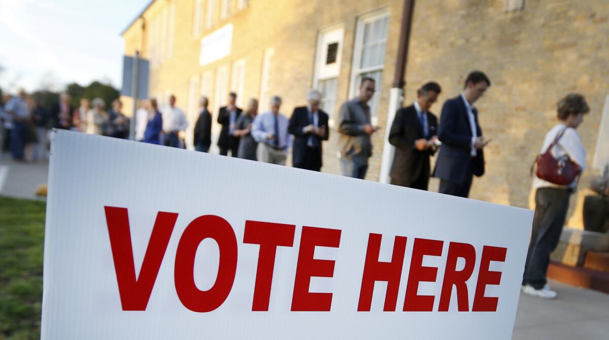 Voters in Fort Worth, Texas, line up to cast their ballots in the presidential primary in March 2016. A woman who illegally voted that same year in the general election has been sentenced to prison.