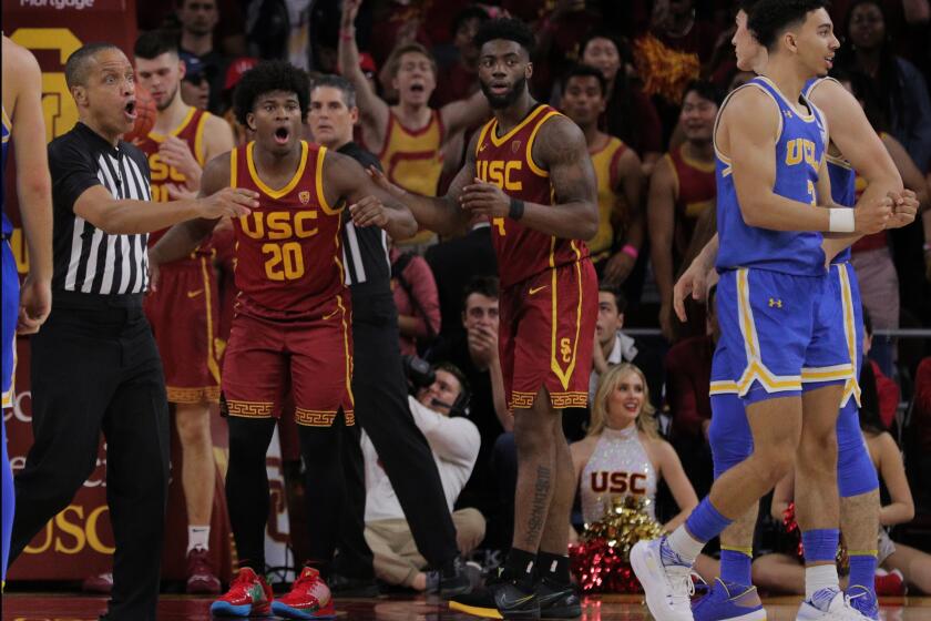 LOS ANGELES, CA - MARCH 7, 2020: USC Trojans guard Ethan Anderson (20) reacts after being called for a foul with less than 10 seconds left in the game against UCLA at Galen Center on March 7, 2020 in Los Angeles, California. USC won 54-52. (Gina Ferazzi/Los AngelesTimes)