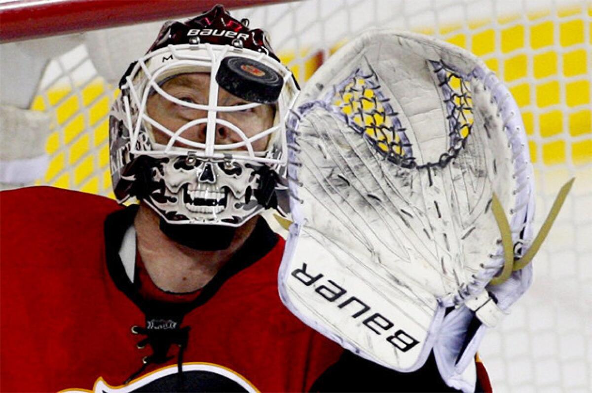 Calgary Flames goalie Miikka Kiprusoff makes a save against the San Jose Sharks.
