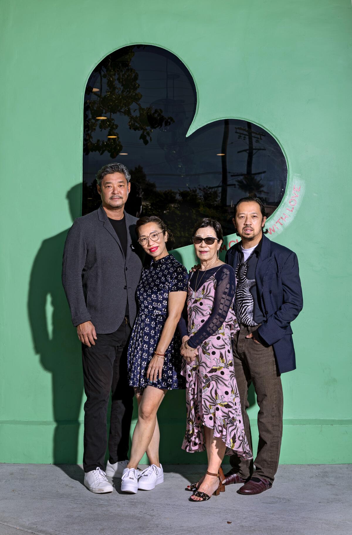 The four owners of Chifa standing in front of the restaurant.