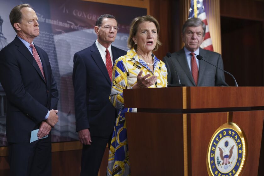 In this photo taken Thursday, May 27, 2021, Sen. Shelley Moore Capito, R-W.Va., the GOP's lead negotiator on a counteroffer to President Joe Biden's infrastructure plan, speaks at a news conference as she is joined by, from left, Sen. Pat Toomey, R-Pa., Sen. John Barrasso, R-Wyo., chairman of the Senate Republican Conference, and Sen. Roy Blunt, R-Mo., at the Capitol in Washington. (AP Photo/J. Scott Applewhite)