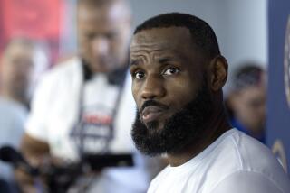 LeBron James of the Los Angeles Lakers listens to a question from a reporter during training camp for the United States men's basketball team Saturday, July 6, 2024, in Las Vegas. (AP Photo/Steve Marcus)