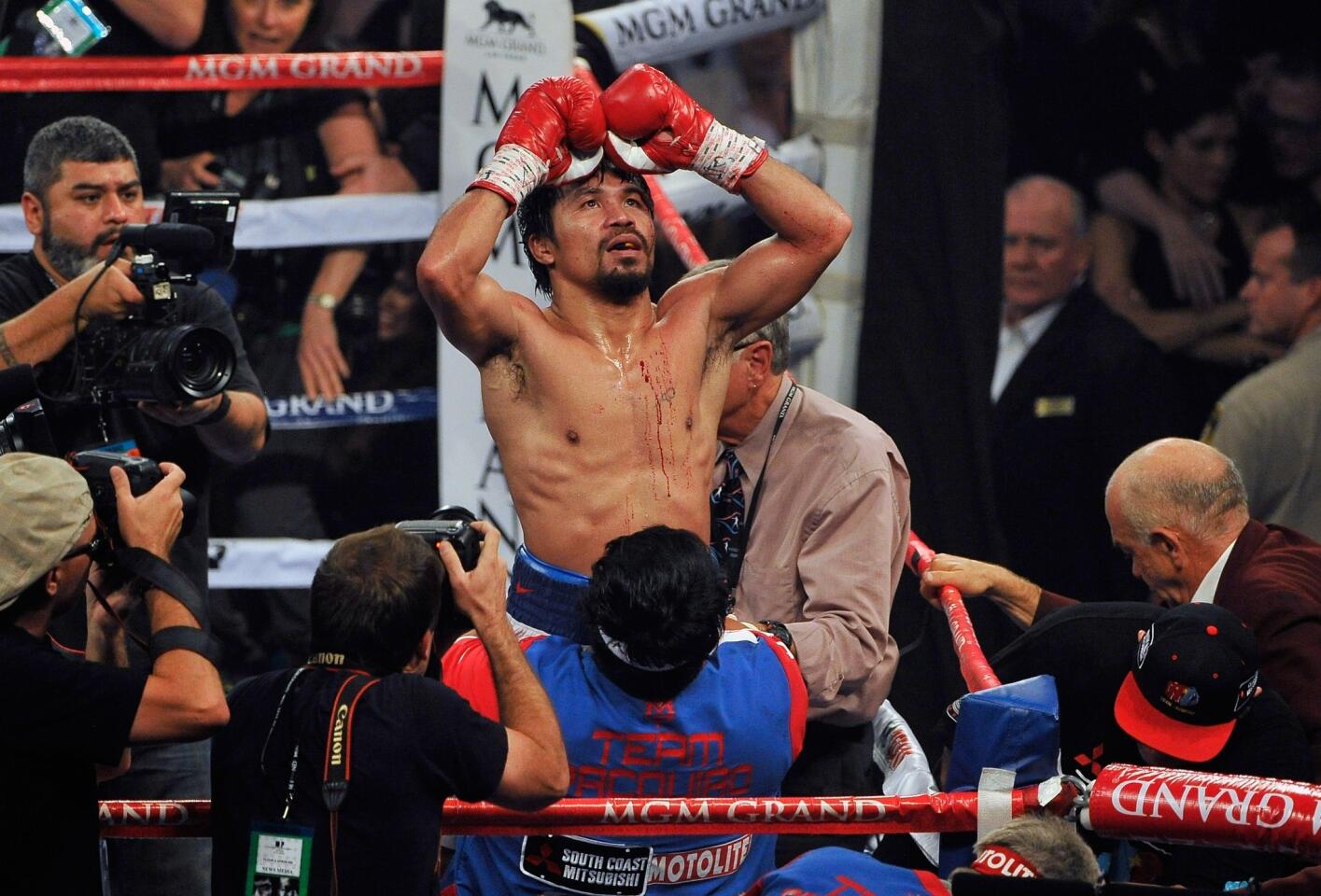 Manny Pacquiao celebrates after his unanimous decision victory over Timothy Bradley in their WBO welterweight championship match April 12, 2014, at the MGM Grand Garden Arena.
