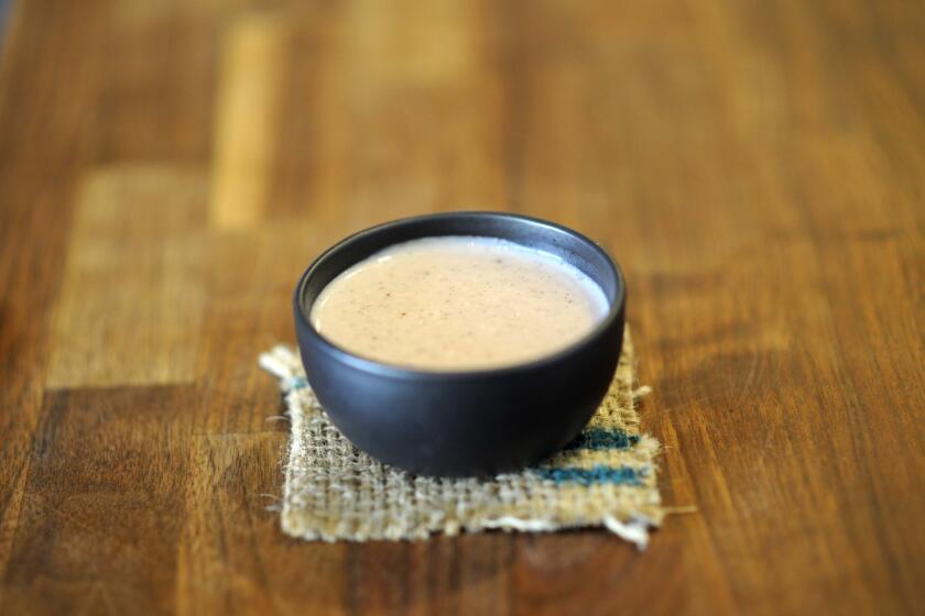 Atole, a masa milk and burnt strawberries drink.