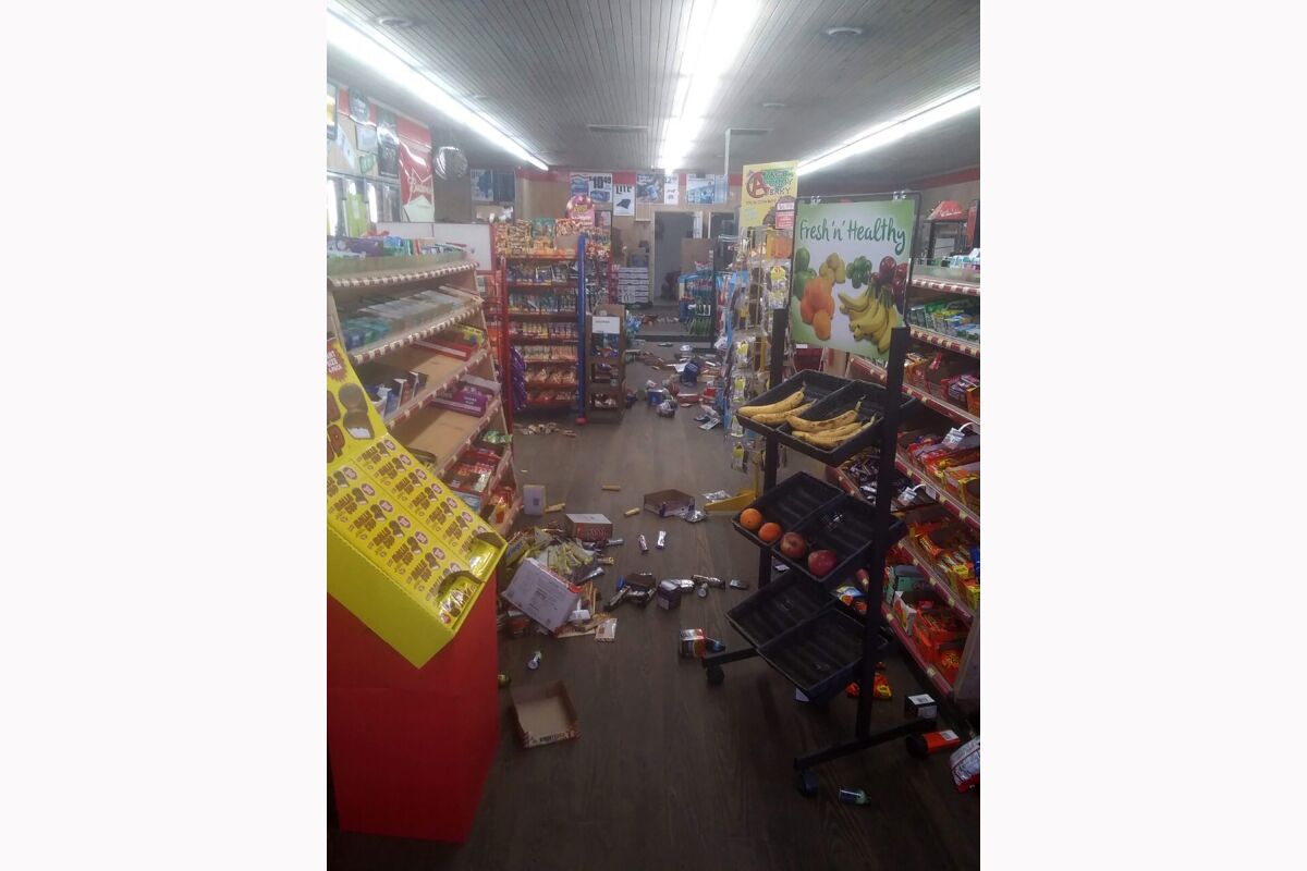 Various items litter the floor of the 4 Brothers Store in Sparta, N.C., after an earthquake.
