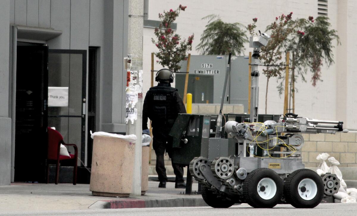 A robot and bomb squad at the scene of a robbery at a Bank of America in East Los Angeles in 2012.