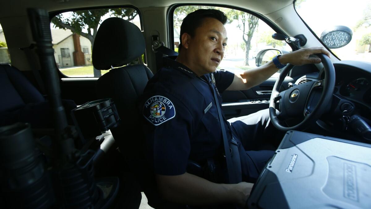 Police Chief Timothy Vu, driving through Alhambra, was named the city's police chief in April. “Ninety-five percent of this job is just talking to people,” said Vu, 46. “The best thing we can do is get out of our car and explain.”