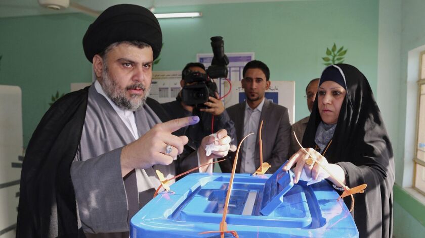 The bloc allied with Muqtada Sadr, shown here in 2014, still holds 54 seats in parliament after the election recount, the most of any faction.