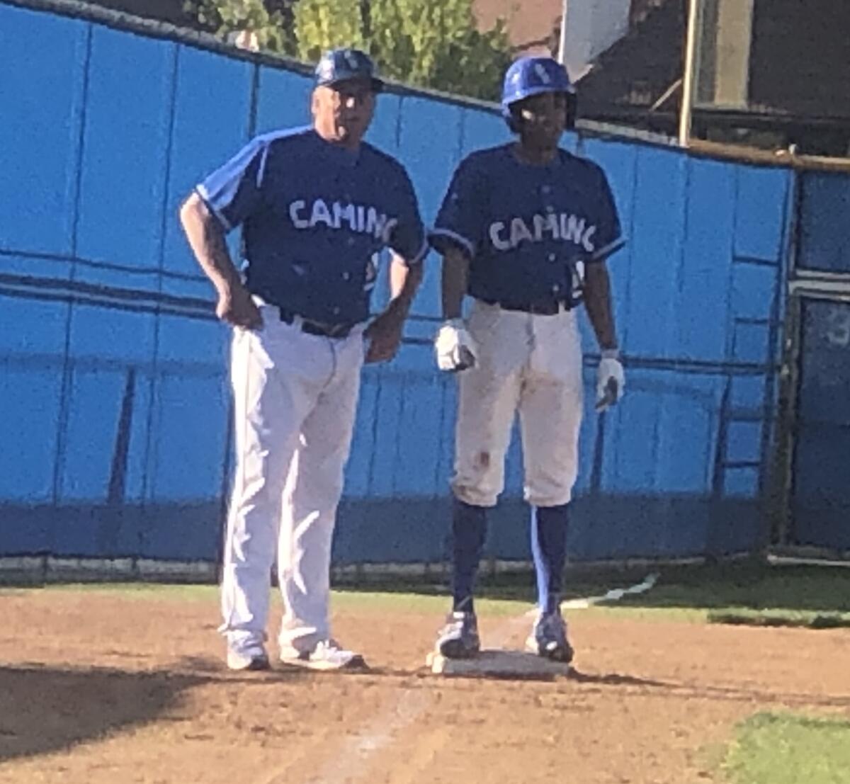 Dominic Carnes, right, had a two-run triple for El Camino Real on Tuesday in a victory over Newbury Park to help the Conquistadores improve to 2-0 in the Easton tournament.