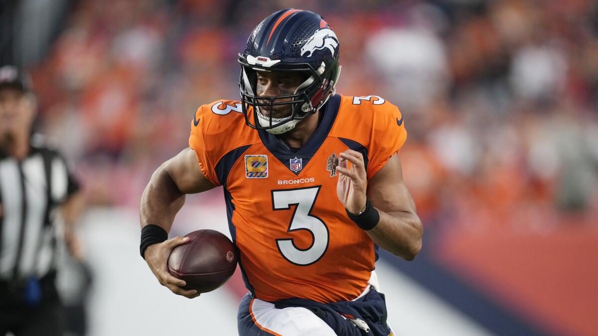 Denver Broncos quarterback Russell Wilson runs with the ball during a loss to the Indianapolis Colts on Oct. 6.