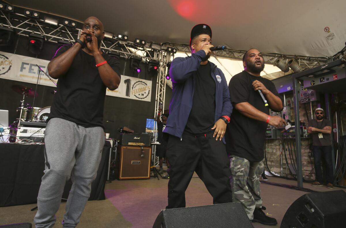 A group of men perform onstage