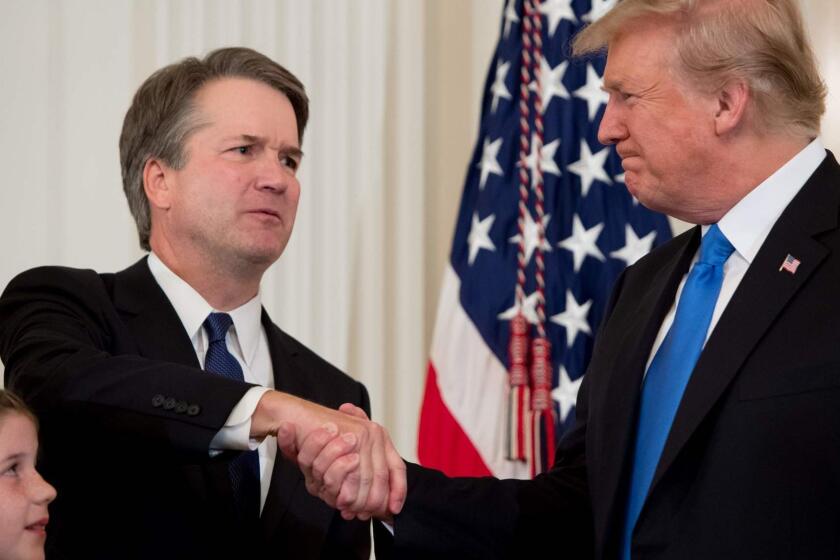 TOPSHOT - US Judge Brett Kavanaugh (L) shakes hands with US President Donald Trump after being nominated to the Supreme Court in the East Room of the White House on July 9, 2018 in Washington, DC. / AFP PHOTO / SAUL LOEBSAUL LOEB/AFP/Getty Images ** OUTS - ELSENT, FPG, CM - OUTS * NM, PH, VA if sourced by CT, LA or MoD **