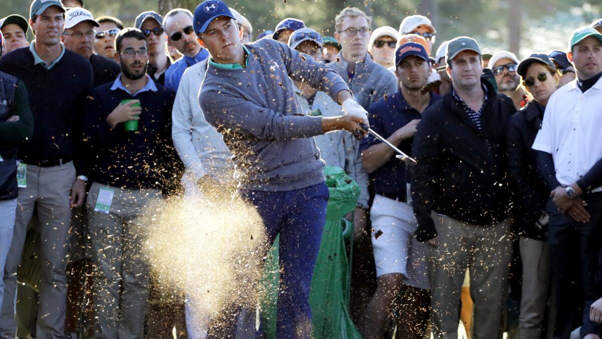 Jordan Spieth hits out of the rough along the 17th fairway Saturday during the third round of the Masters.