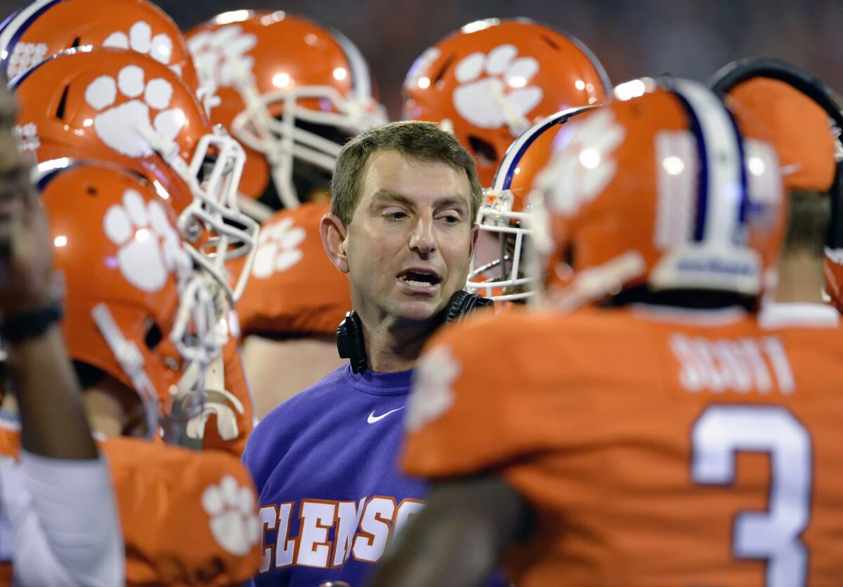 Clemson Coach Dabo Swinney talks to his team during a game against Syracuse on Oct. 14.
