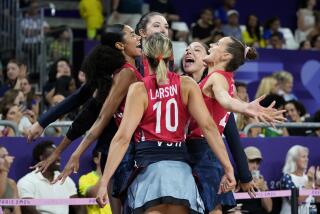 U.S. players celebrate during a semifinal women's volleyball match against Brazil at the 2024 Summer Olympics 