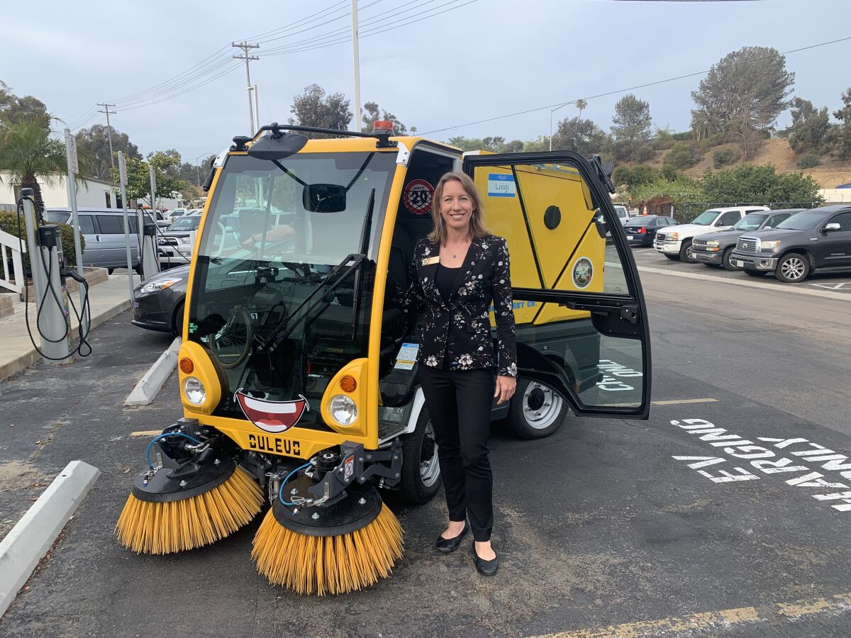 Encinitas Mayor Catherine Blakespear with the new street sweeper, "Luigi".