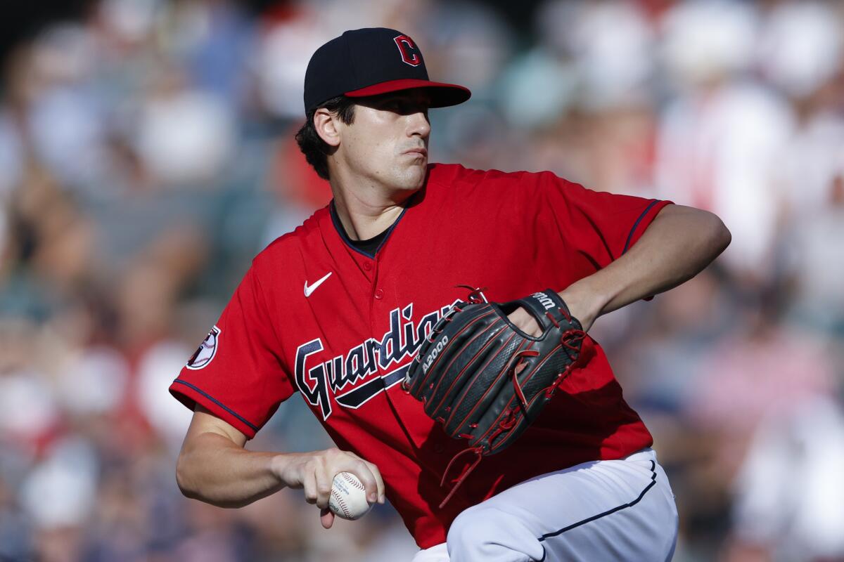 Cleveland Guardians starting pitcher Cal Quantrill winds up during the first inning of the team's baseball game against the Houston Astros, Saturday, Aug. 6, 2022, in Cleveland. (AP Photo/Ron Schwane)