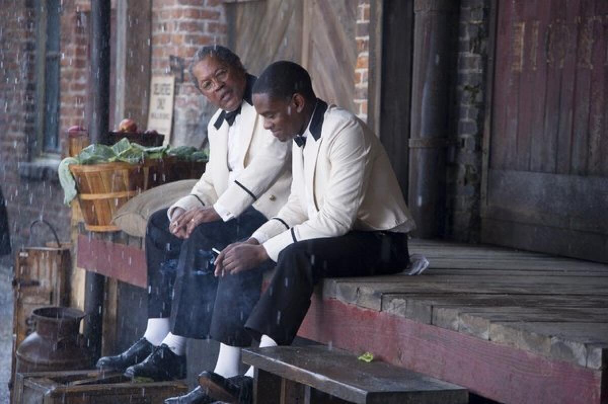 This film image released by The Weinstein Company shows Clarence Williams, left, and Aml Ameen in a scene from "Lee Daniels' The Butler."