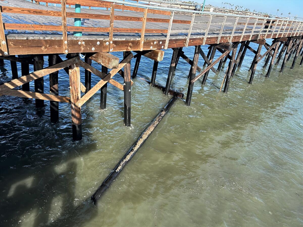 A pylon on the Seal Beach Pier, seen Friday, was one of several washed away by Thursday night's high surf.
