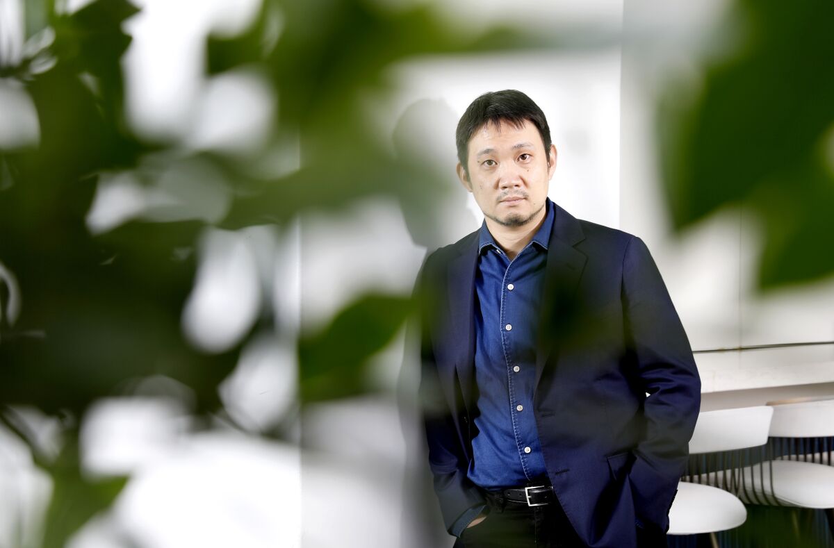 Japanese filmmaker Ryûsuke Hamaguchi poses for a portrait.