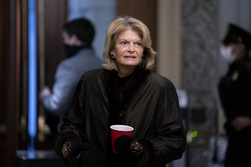 Sen. Lisa Murkowski, R-Alaska, arrives at the start of the fifth day of the second impeachment trial of former President Trump, Saturday, Feb. 13, 2021 at the Capitol in Washington. (Stefani Reynolds/Pool via AP)