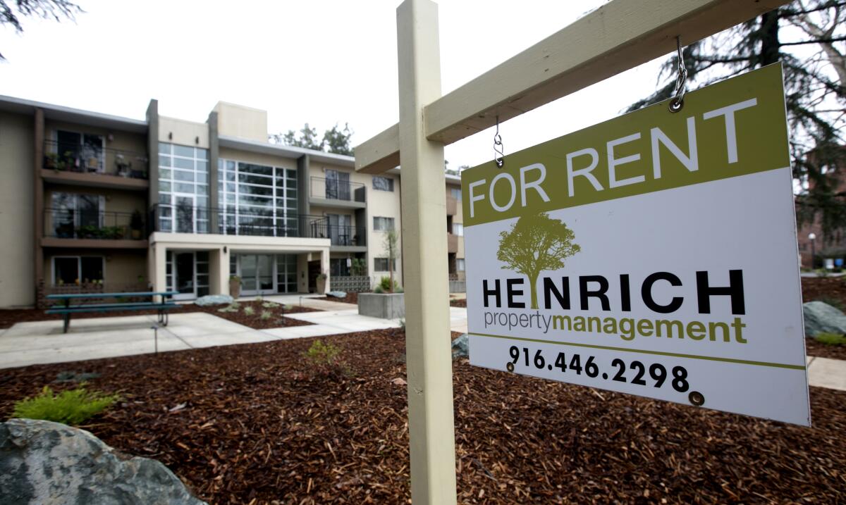 FILE - This Monday, Jan. 8, 2017, file photo shows a "For Rent" sign outside an apartment building in Sacramento, Calif. California Gov. Gavin Newsom reached a deal with apartment owners and developers Friday, Aug. 30, 2019, on legislation that would cap how rapidly rents can rise as the state grapples with a housing crisis. (AP Photo/Rich Pedroncelli, File)