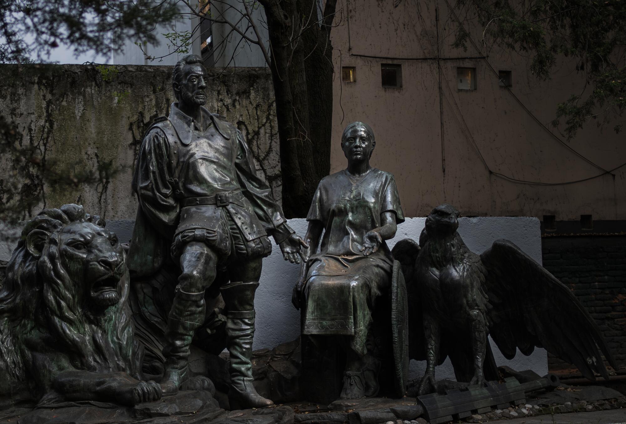 the Monumento al Mestizaje depicts Hernan Cortes and La Malinche at Parque Xicotencatl