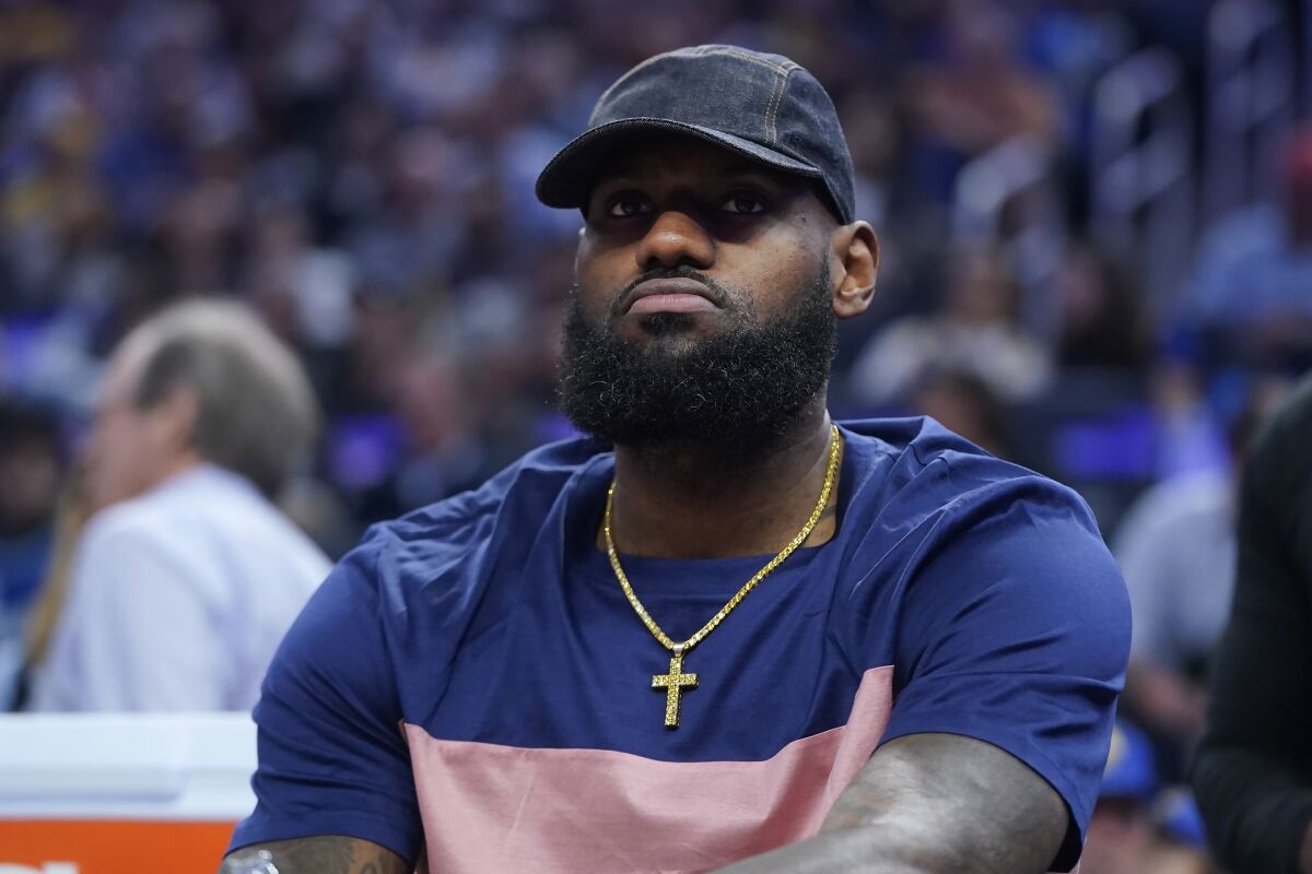 Los Angeles Lakers' LeBron James sits on the bench during the first half of the team's NBA basketball game against the Golden State Warriors in San Francisco, Thursday, April 7, 2022. (AP Photo/Jeff Chiu)