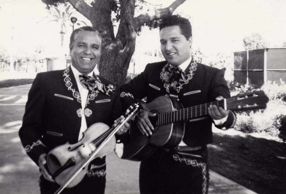 Gabriel B. Zavala stands next to his son Oliver Zavala