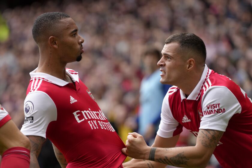 Arsenal's Gabriel Jesus, left, celebrates with Arsenal's Granit Xhaka after scoring his side's second goal during the English Premier League soccer match between Arsenal and Tottenham Hotspur, at Emirates Stadium, in London, England, Saturday, Oct. 1, 2022. (AP Photo/Kirsty Wigglesworth)