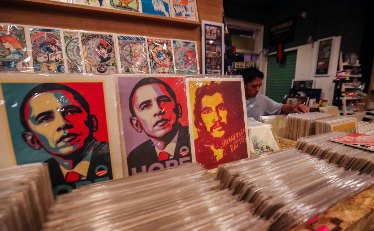 Posters of President Obama are for sale May 21 at a gallery in Ho Chi Minh City.