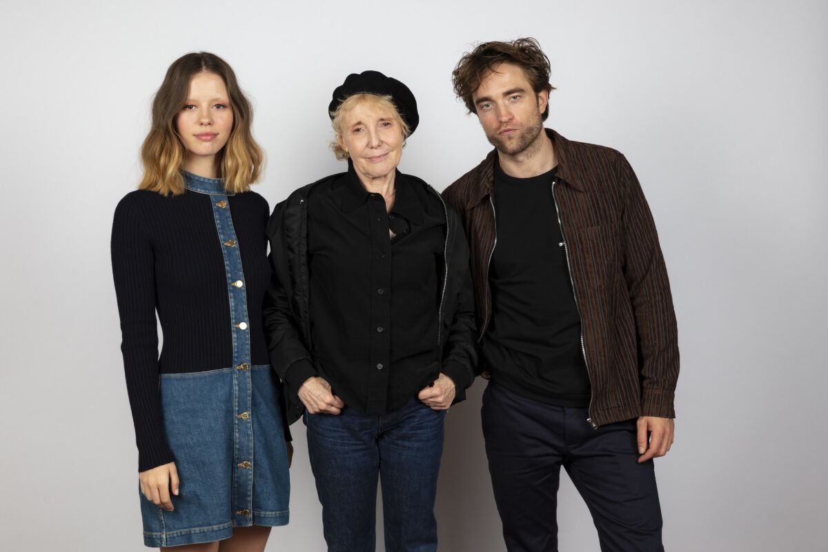 Director Claire Denisis flanked by "High Life" stars Mia Goth and Robert Pattinson in the L.A. Times Photo Studio at TIFF.