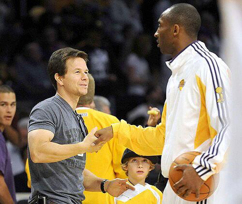 Lakers guard Kobe Bryant greets actor Mark Wahlberg before Game 2 on Sunday at Staples Center.