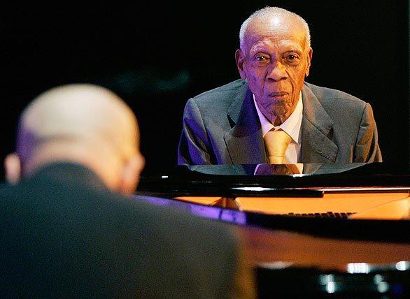 Bebo Valdes, right, and his son Chucho, a world-class Latin jazz pianist in his own right, perform at an event in Madrid in honor of Valdes 90th birthday. The father and son share the same birthday.