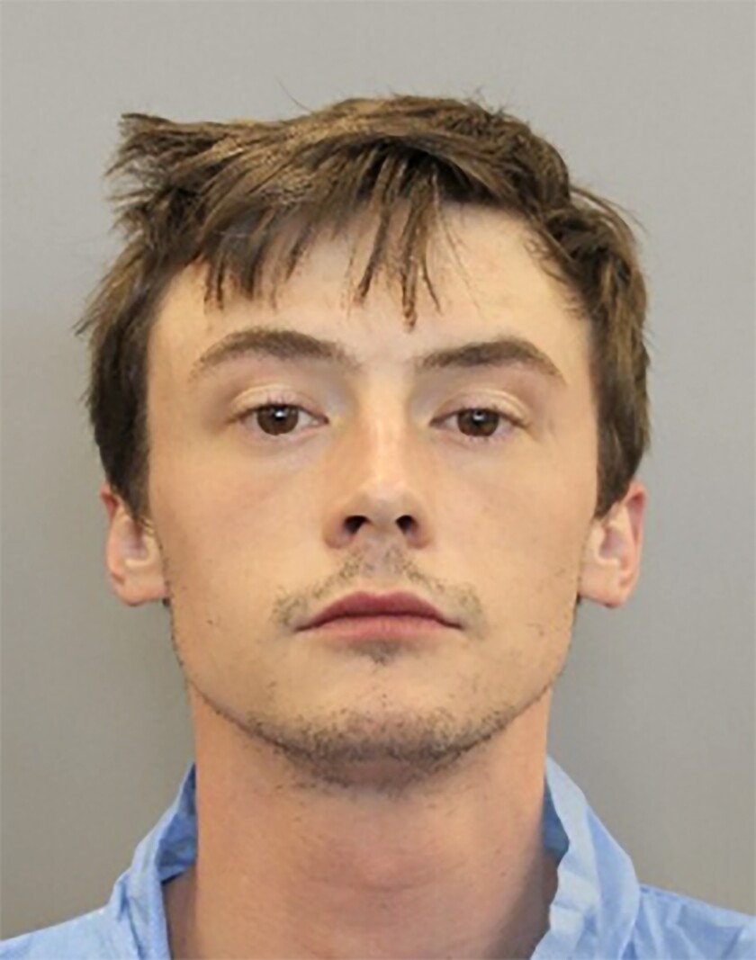 In this undated booking photo provided by the Houston, Texas Police Department shows Ryan Mitchell. Mitchell who is accused of stabbing a police dog Saturday, was free on bond and now on the run Tuesday, Jan. 25, 2022, after police alleged he fled from officers and led them on a chase when they sought to question him over his missing father, whose body was later discovered hidden in his home's garage. (AP Photo Houston Police Department)