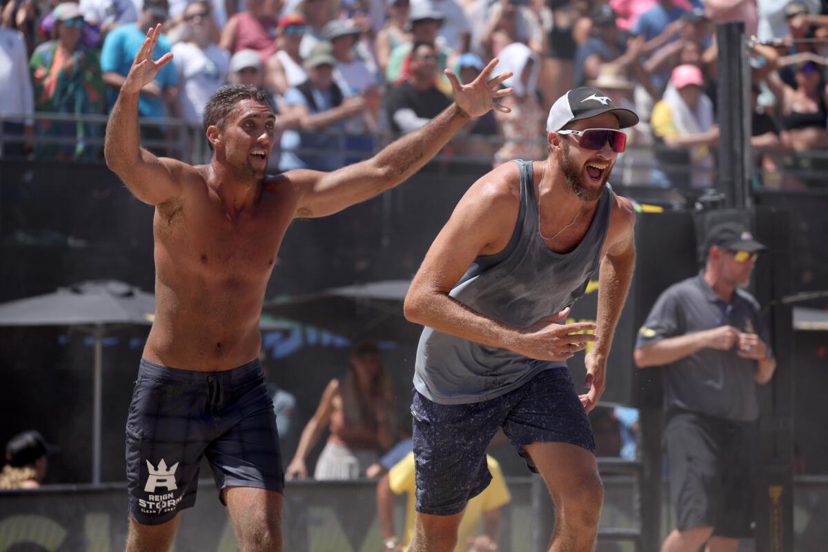 Trevor Crabb and Theo Brunner celebrate after winning the AVP Manhattan Beach Open on Sunday.