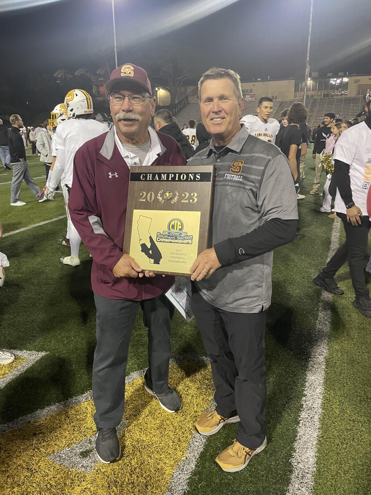 Simi Valley coach Jim Benkert (right) with his longtime assistant Richard Fong after his team won the Division 6 title.
