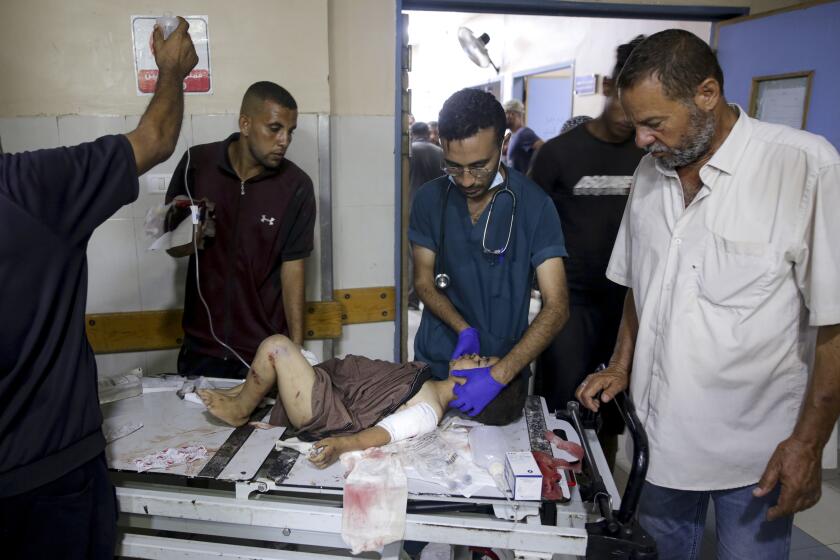 A Palestinian boy wounded in the Israeli bombardment of the Gaza Strip is treated in a hospital in Khan Younis, Tuesday, July 9, 2024. (AP Photo/Jehad Alshrafi)
