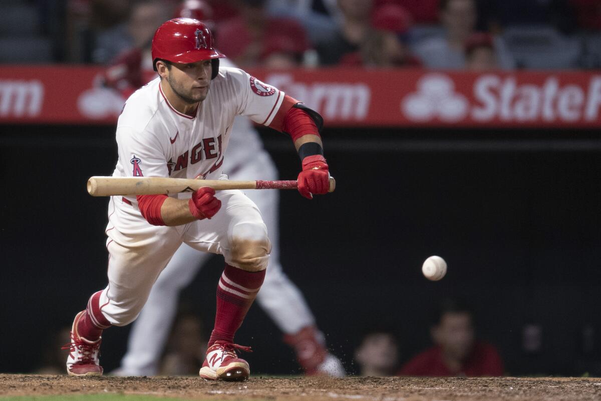 David Fletcher drops a sacrifice bunt against the Detroit Tigers on Saturday.