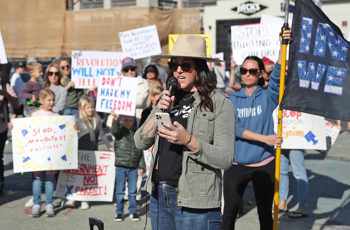 Heather Puhek of the Unity Project speaks in support of the Children's Medical Freedom rally on Monday.