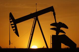 FILE- A pump jack is silhouetted against the setting sun in Oklahoma City on March 22, 2012. Minority neighborhoods where residents were long denied home loans have twice as many oil and gas wells as mostly white neighborhoods, according to a new study that suggests ongoing health risks in vulnerable communities are at least partly tied to historical structural racism. (AP Photo/Sue Ogrocki, File)