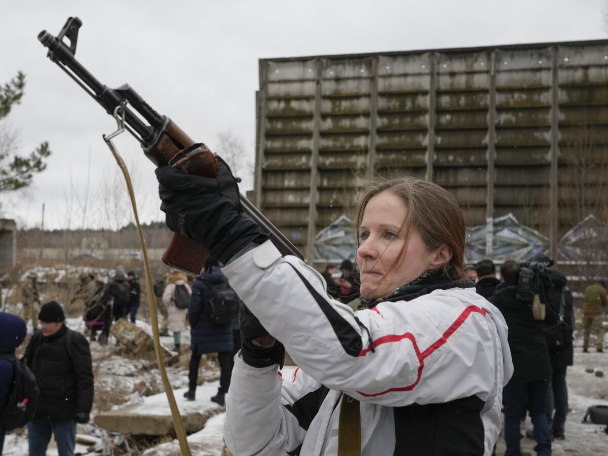 A member of a Ukrainian volunteer unit brandishing a rifle.