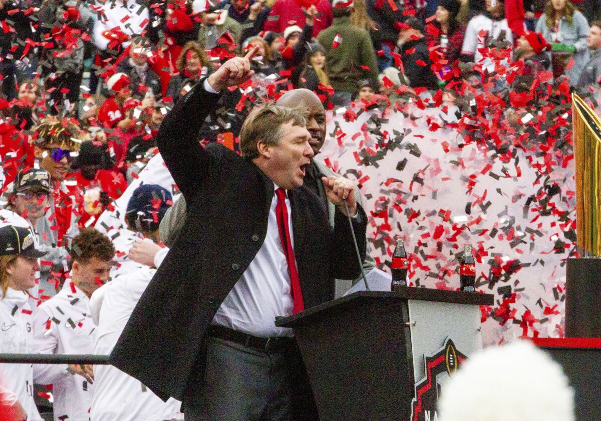 Georgia coach Kirby Smart cheers on the crowd during the NCAA college football champions victory celebration at Stanford Stadium in Athens, Ga.,, Saturday, Jan. 15, 2022. (Steve Schaefer/Atlanta Journal-Constitution via AP)