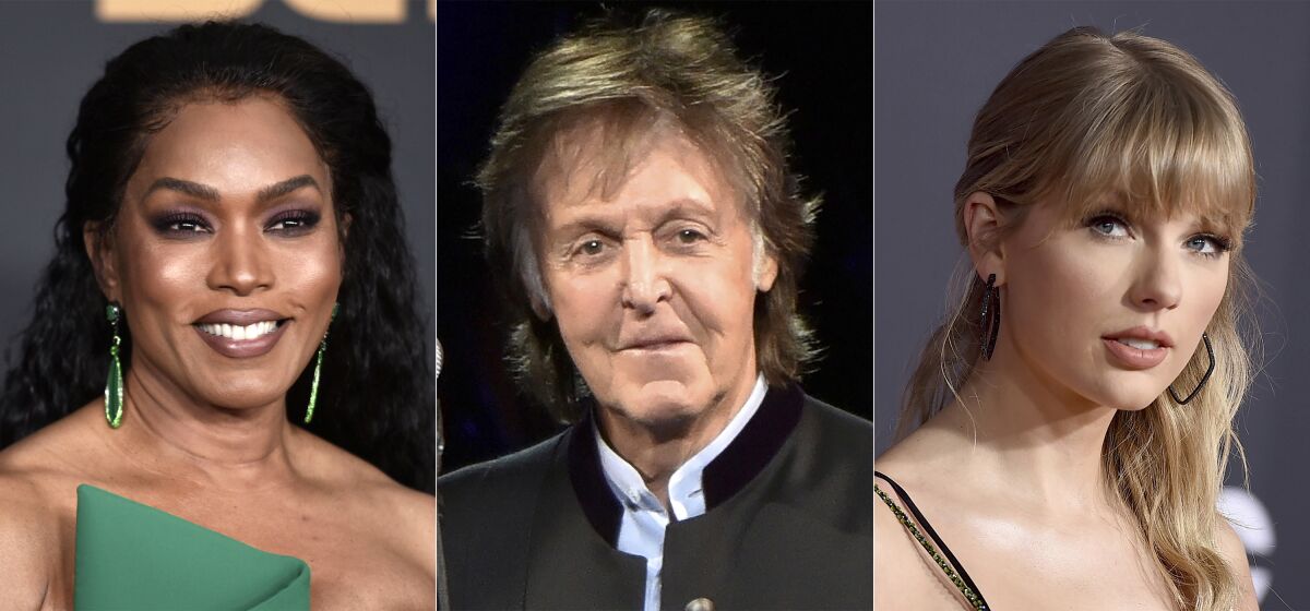 This combination of photos shows Angela Bassett at the 51st NAACP Image Awards in Pasadena, Calif., on Feb. 22, 2020, from left, Paul McCartney during his One on One Tour in Tinley Park, Ill., on July 26, 2017, and Taylor Swift at the American Music Awards in Los Angeles on Nov. 24, 2019. Bassett will induct singer Tina Turner into the Rock and Roll Hall of Fame during its annual ceremony, set for Cleveland on Oct. 30. McCartney will give the presentation for Foo Fighters and Swift will induct songwriter Carole King, and also perform some of her music, along with Jennifer Hudson. (AP Photo)