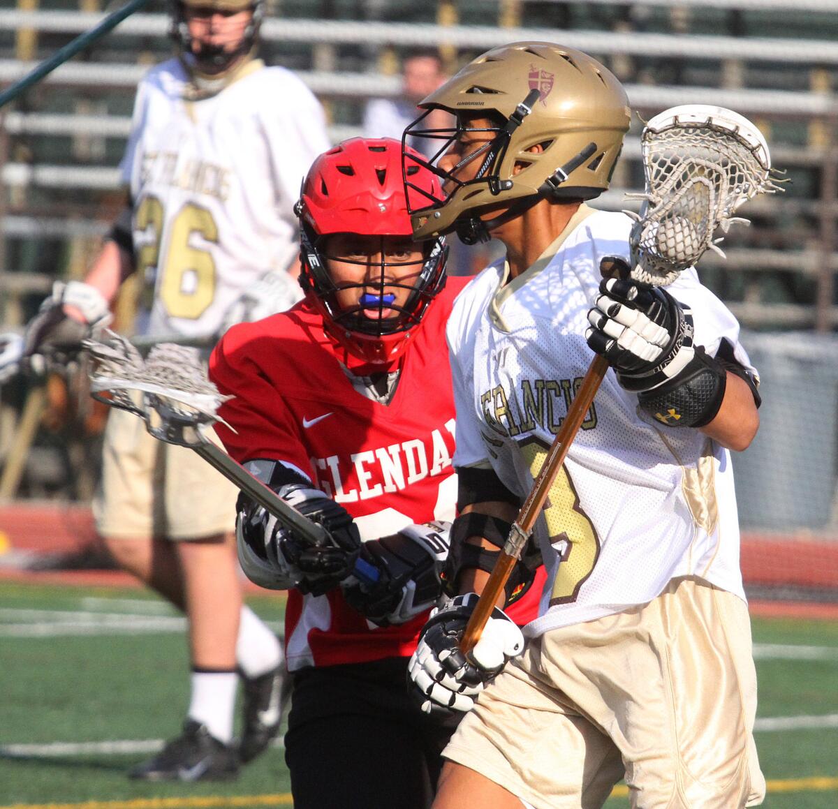 St. Francis attacker Evan Swayne runs for a position to pass against Glendale High's Jesus Chavez on Thursday, March 27, 2014.