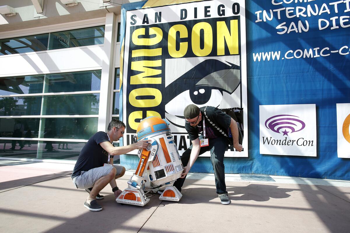 Cory Pacione, left, and Nick Murray with their model of R2-D2 at the 2013 Comic-Con at the San Diego Convention Center.